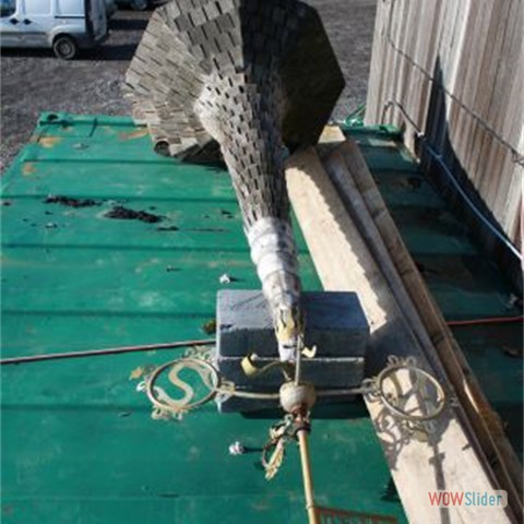 06 Damaged roof and weather vane